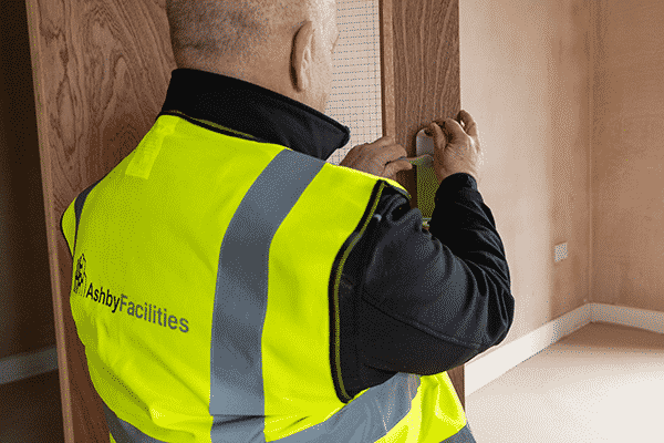 ashby facilities construction worker fitting interior door handle