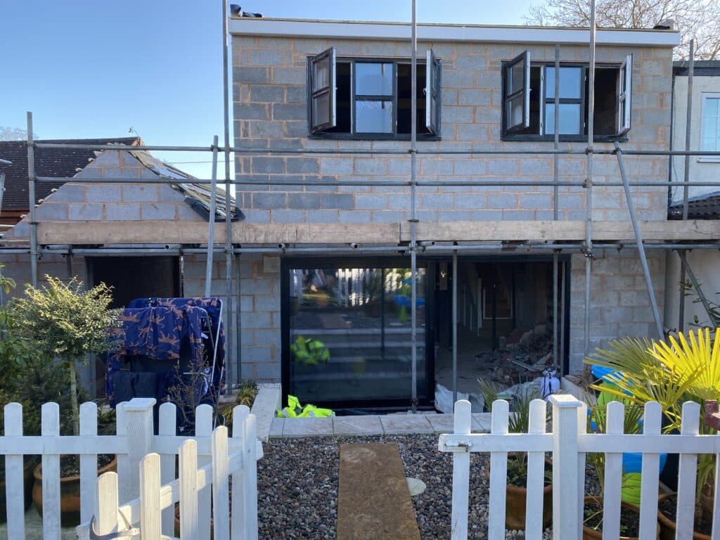 two storey extension with scaffolding whilst working